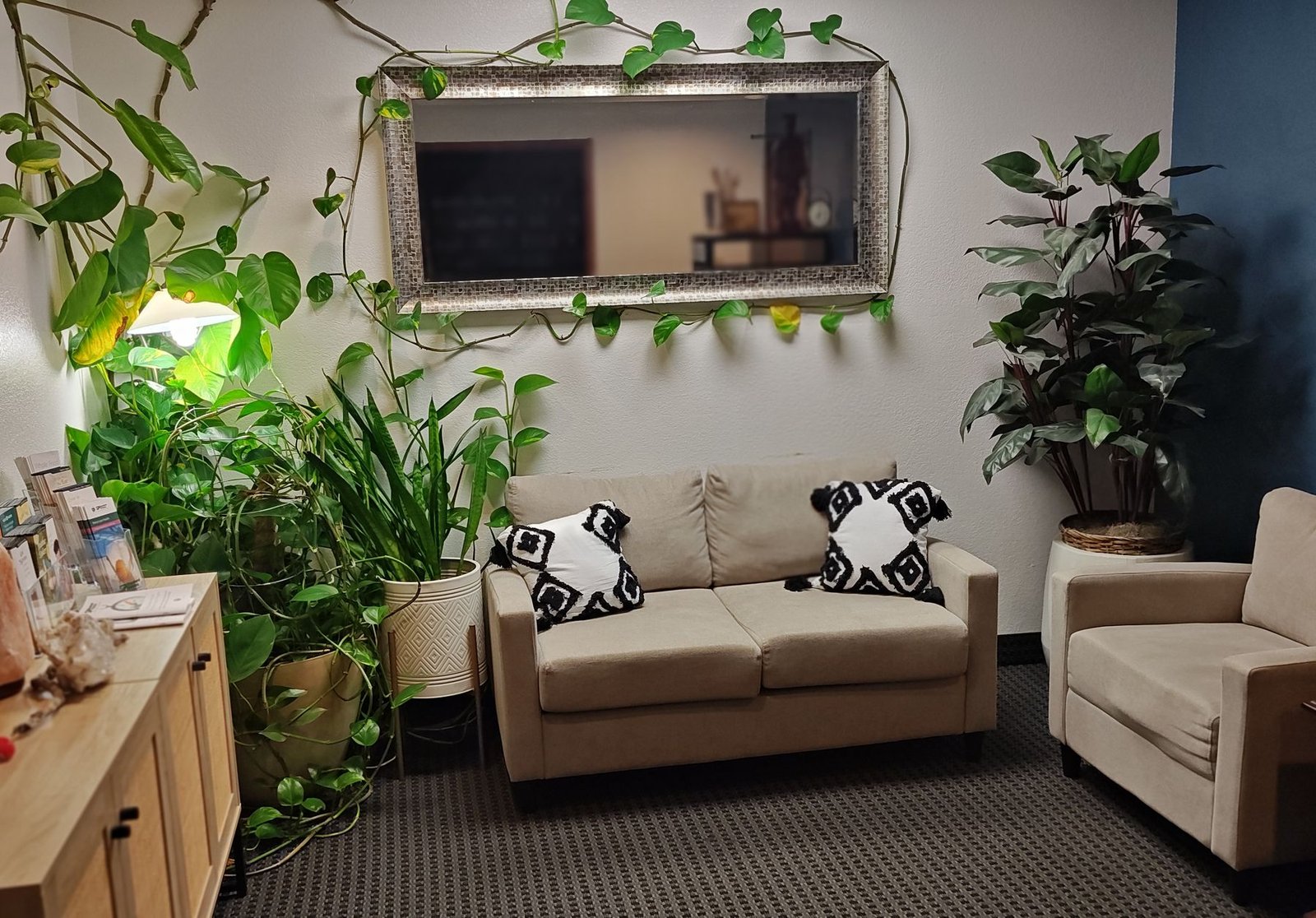 The calm, plant-filled waiting area at Arbor Creek Health & Wellness in Olathe